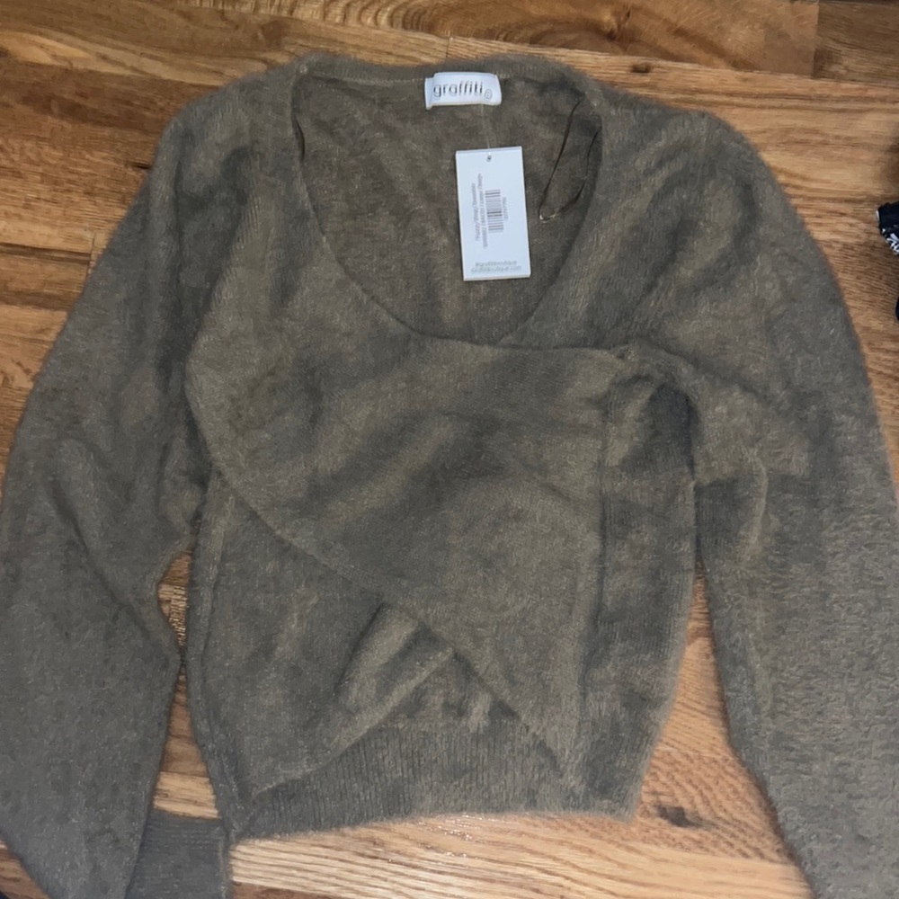 Fuzzy wrap sweater in size large never worn! Brown and from graffiti boutique!